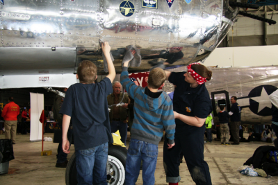 Submitted photo by Al Hudson Volunteers polish the Yankee Air Museum's WWII-era B-25 medium bomber "Yankee Warrior" during the 2014 Bomber Buffing party. This year's 20th annual project is Saturday at the museum at Willow Run Airport.