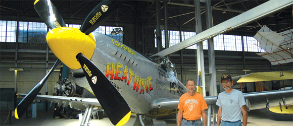 Curt Arseneau, left, and Norm Meyers with the completely restored P-51H Mustang vintage World War II fighter at Chanute Air Museum in September 2013.   Photographer:  Dave Hinton/Rantoul Press