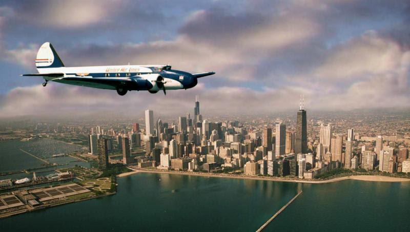 The Museum's Boeing 247D over the Chicago skyline in the late 1990s. Museum of Flight photo.