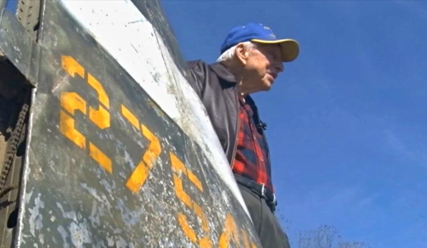 Charlie Screws reunited with the tail of his P-47 Thunderbolt