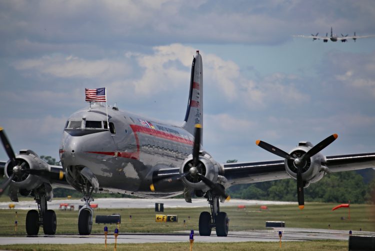 Berlin Airlift Historical Foundation's C-54 "Spirit of Freedom" taxiing to air show center  while the CAF's B-29 "FIFI" departs with passengers
