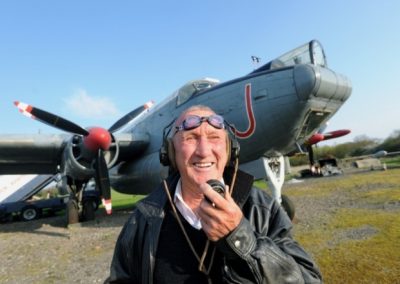 Peter Vallance in front of a Shackleton aircraft at the gatwick aviation museum. Photo by Jon Rigby 
